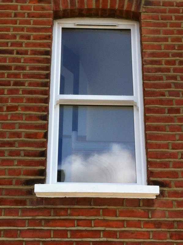 uPVC sash window on Victorian red brick house in East Sheen